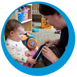 Teacher reading book to baby at school "Back to School" time is here!